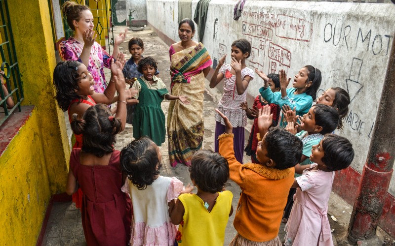Emily interacts with the children in Tangra playing games with them just outside our centre.