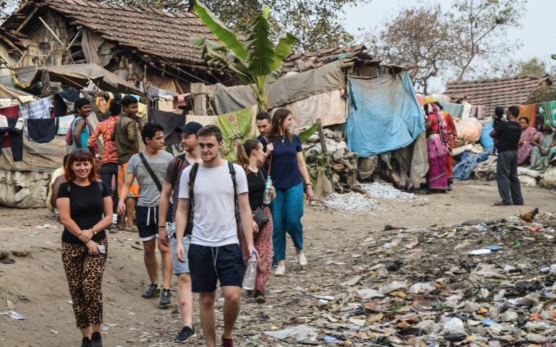 The group makes their way through the community near our Tangra centre.